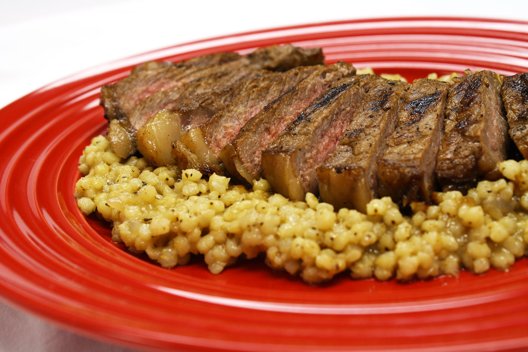 KC Strip Steak over Pearled Pilaf Nu Life Market